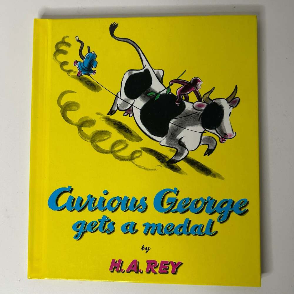 Curious George Gets a Medal by H.A. Rey Hardcover Book